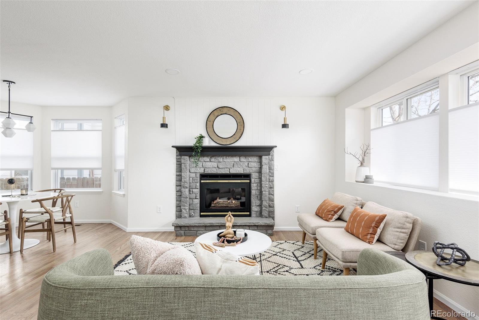 10754 West 107th Circle Westminster, CO 80021 - Photo 9 of 24 a living room with furniture and a fireplace
