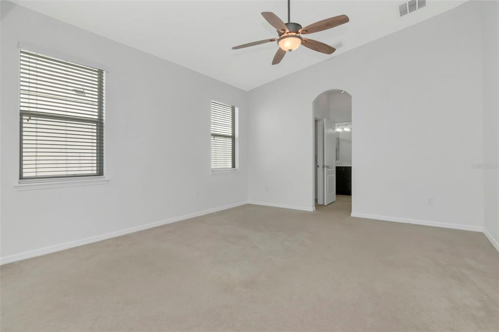 11229 Spring Point Circle Riverview, FL 33579 - Photo 14 of 40 an empty room with windows and fan