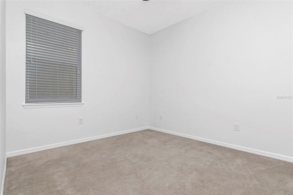 11229 Spring Point Circle Riverview, FL 33579 - Photo 22 of 40 an empty room with a window