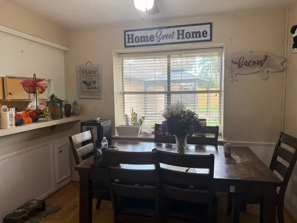 a view of a dining room with furniture window and outside view
