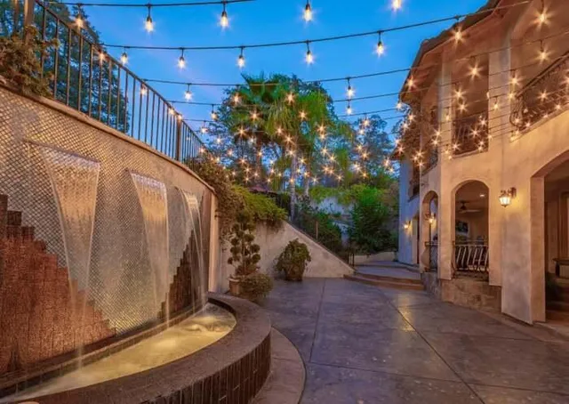 a view of a swimming pool with sitting area