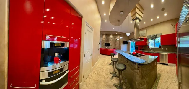 a kitchen with stainless steel appliances granite countertop a sink stove and cabinets