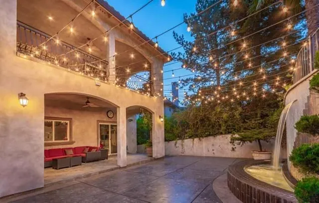a view of a patio with table and chairs potted plants with wooden floor