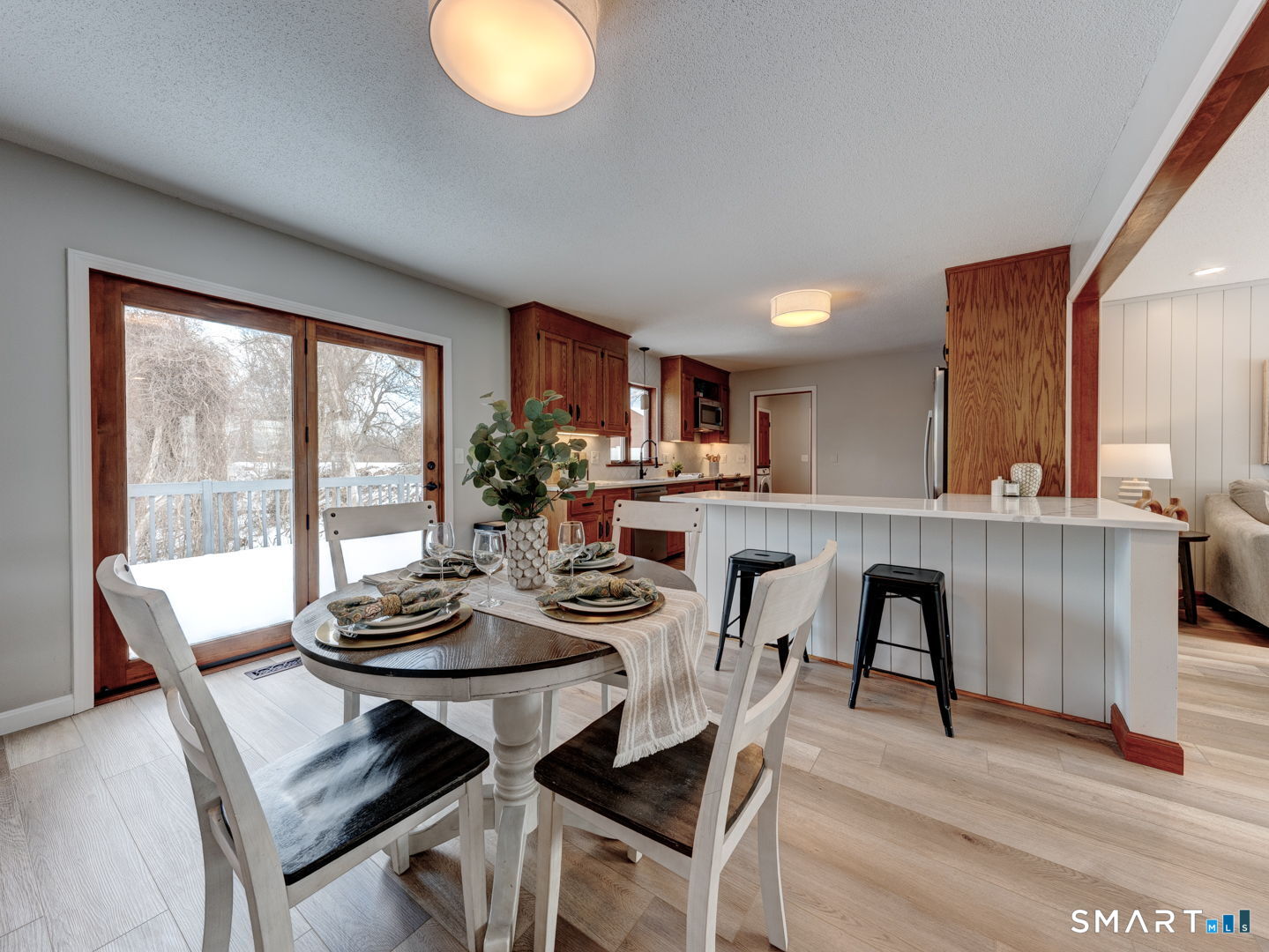 a view of a dining room with furniture window and outside view
