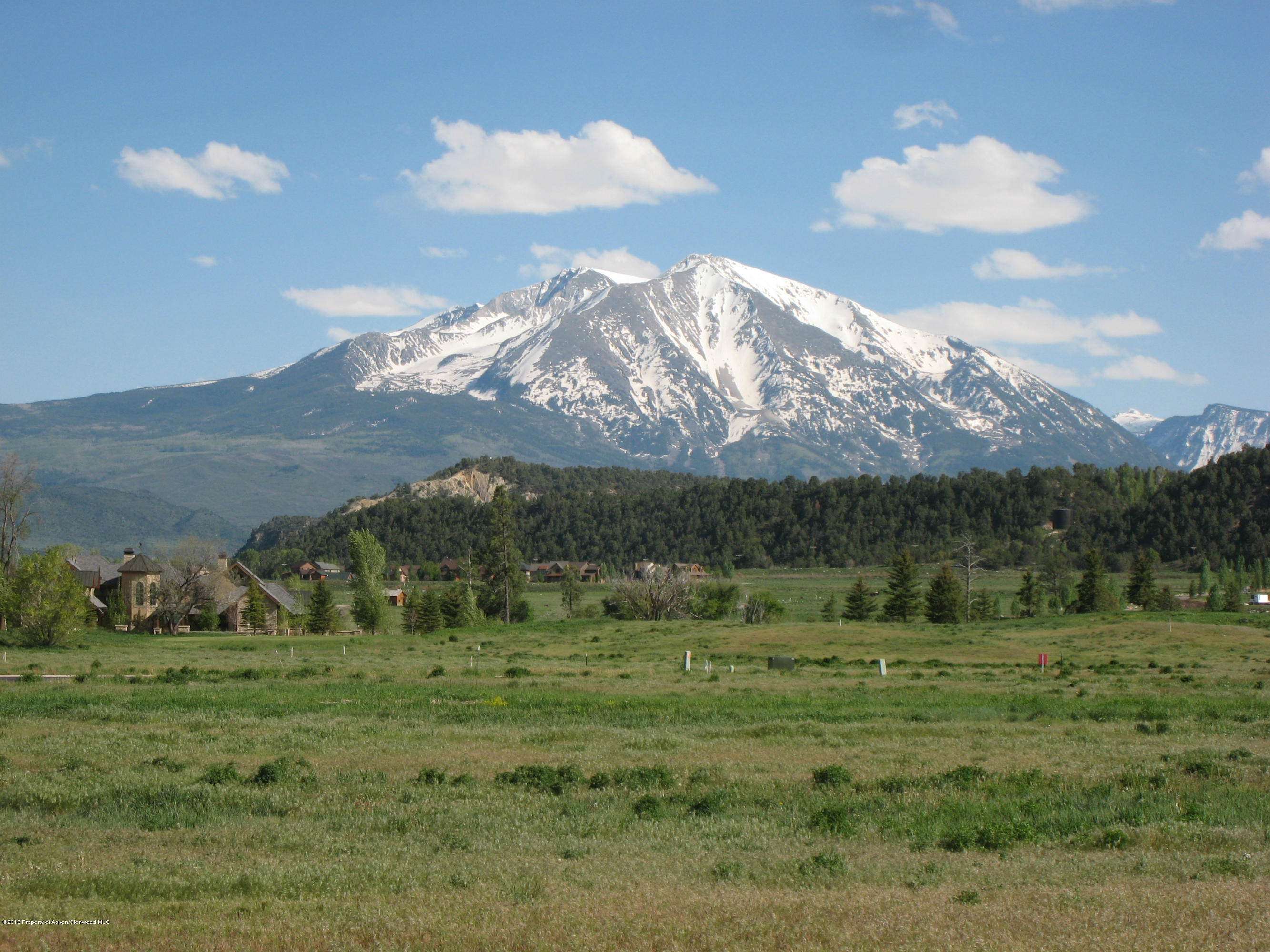 Tbd West Diamond A Ranch Road Carbondale, CO 81623 - Photo 1 of 9 a view of a grassy field with mountains in the background