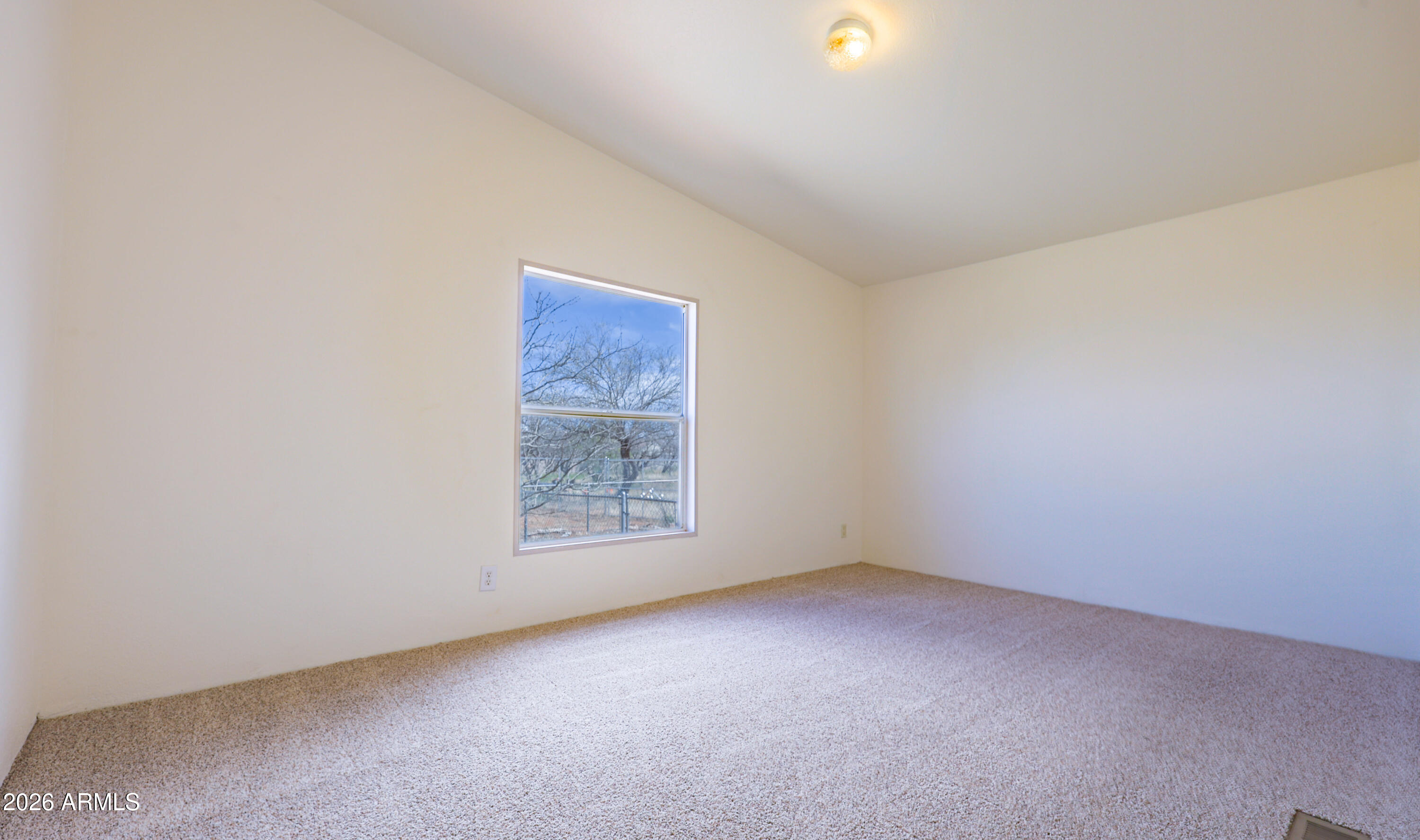 5144 Clearview Road Sierra Vista, AZ 85650 - Photo 24 of 32 an empty room with a empty space and window