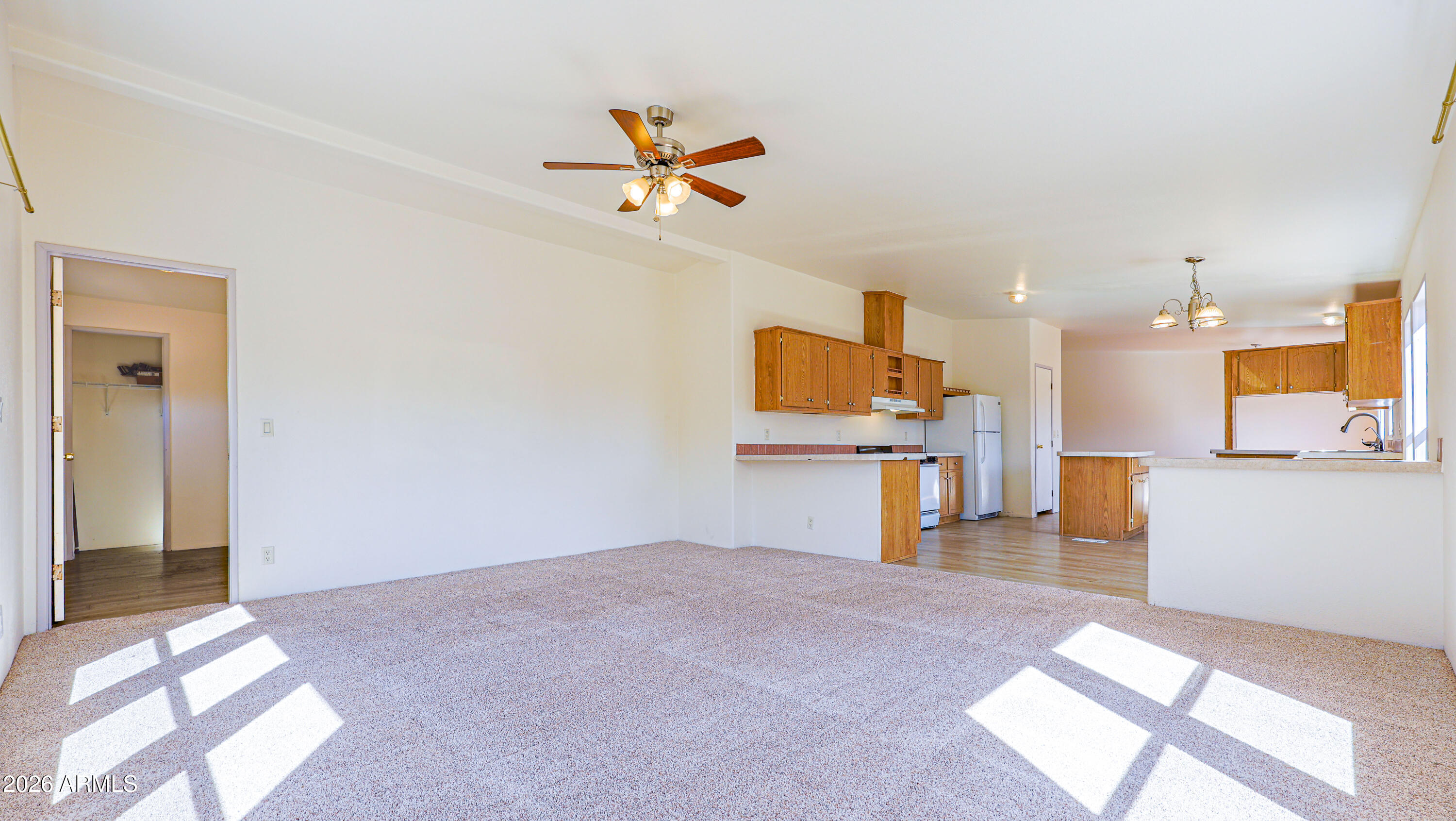 5144 Clearview Road Sierra Vista, AZ 85650 - Photo 9 of 32 a view of a livingroom with a furniture and a ceiling fan