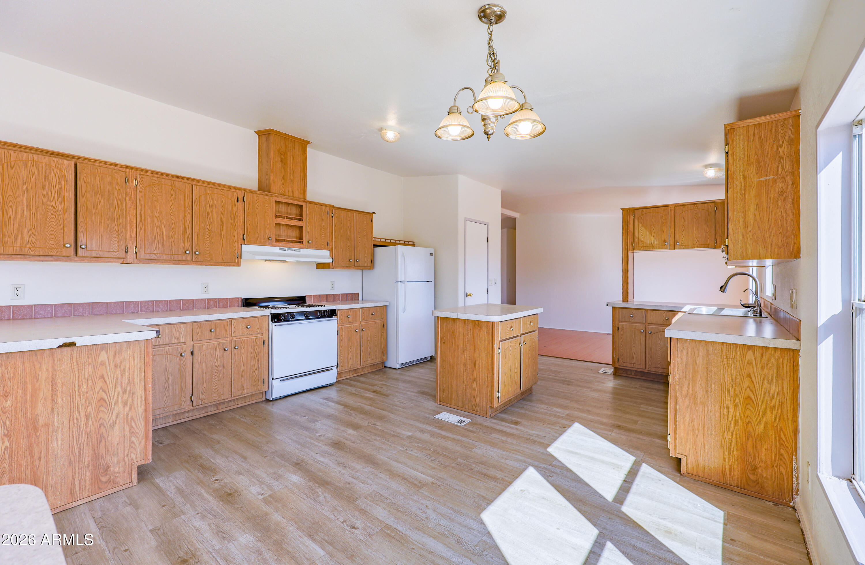 5144 Clearview Road Sierra Vista, AZ 85650 - Photo 10 of 32 a kitchen with a sink cabinets and window