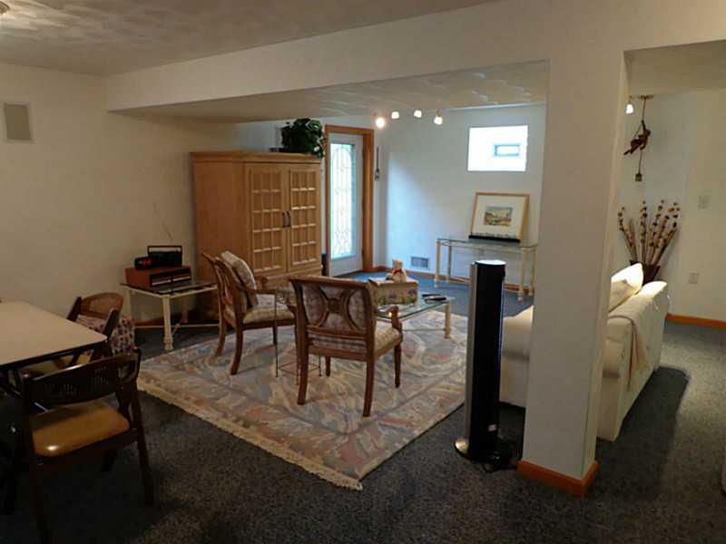 1065 Finchley Road North Huntingdon, PA 15642 - Photo 22 of 25 Family Room. This enormous 26 x 25 family room has a full bath and a grade level door to the yard.