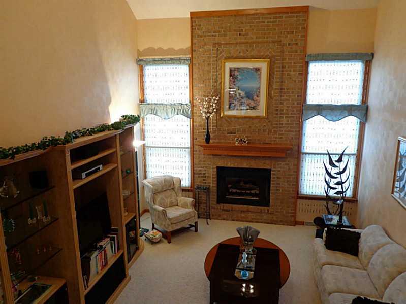1065 Finchley Road North Huntingdon, PA 15642 - Photo 5 of 25 Living Room. This dramatic two story living room is the centerpiece of the home. It is perfectly accented by the tall brick fireplace, flanked by 2 large windows. This room measures 19 feet by 15 feet.