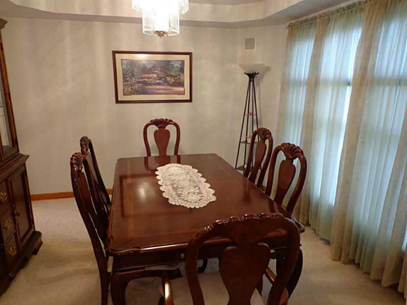 1065 Finchley Road North Huntingdon, PA 15642 - Photo 7 of 25 Dining Room. This formal dining room features an elegant tray ceiling and looks over the yard with lovely large windows.