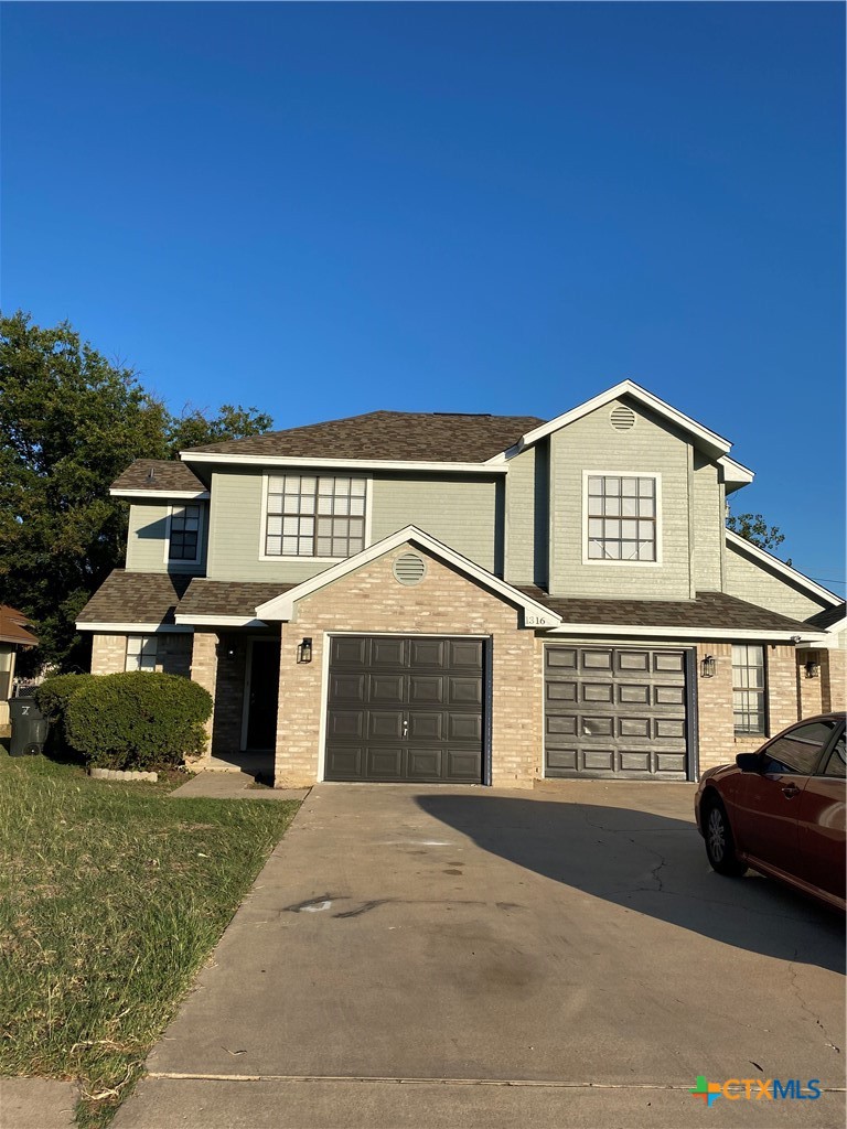 1316 Opal Road, Unit A Killeen, TX 76543 - Photo 2 of 25 a front view of a house with a yard