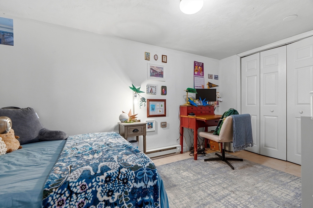 45 Lawn Street Boston, MA 02120 - Photo 13 of 22 a bedroom with a workspace