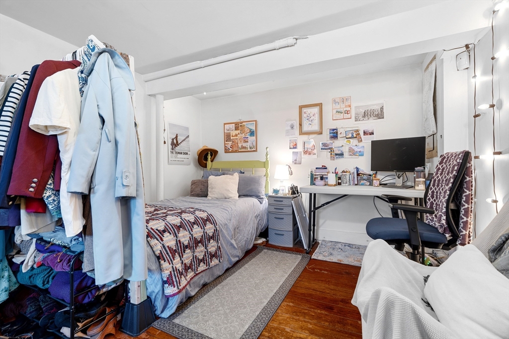45 Lawn Street Boston, MA 02120 - Photo 15 of 22 a bedroom with a bed and a couch