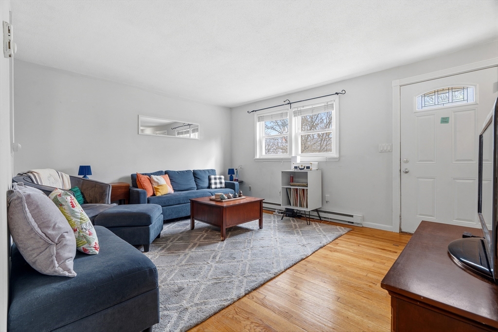 45 Lawn Street Boston, MA 02120 - Photo 2 of 22 a living room with furniture and a window