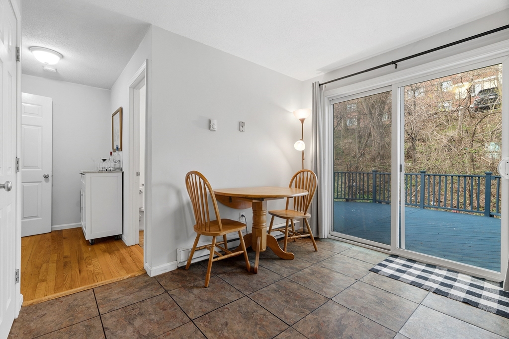 45 Lawn Street Boston, MA 02120 - Photo 6 of 22 a view of a dining room with furniture and a floor to ceiling window