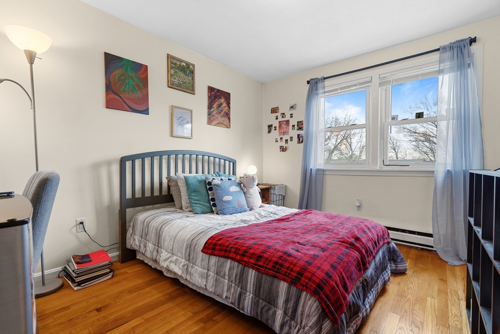 45 Lawn Street Boston, MA 02120 - Photo 8 of 22 a bedroom with bed and a window