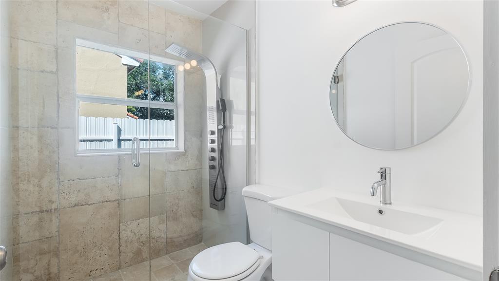 1811 Southwest 124th Way Miramar, FL 33027 - Photo 16 of 29 a bathroom with a sink toilet and shower
