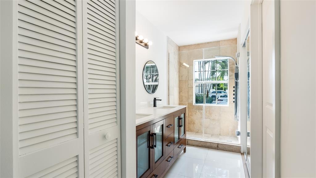 1811 Southwest 124th Way Miramar, FL 33027 - Photo 24 of 29 a bathroom with a bathtub and a window