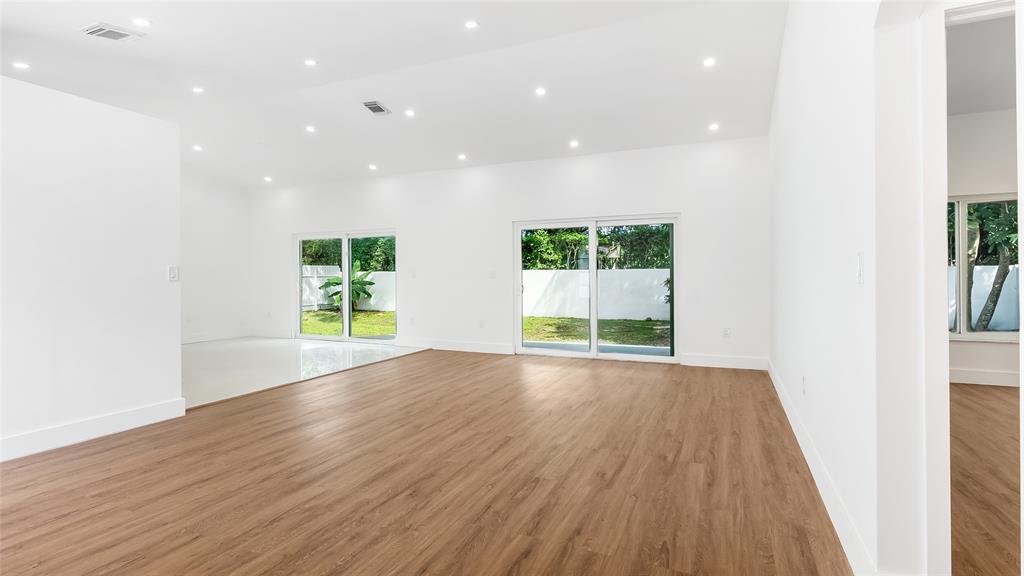 1811 Southwest 124th Way Miramar, FL 33027 - Photo 3 of 29 an empty room with wooden floor and windows
