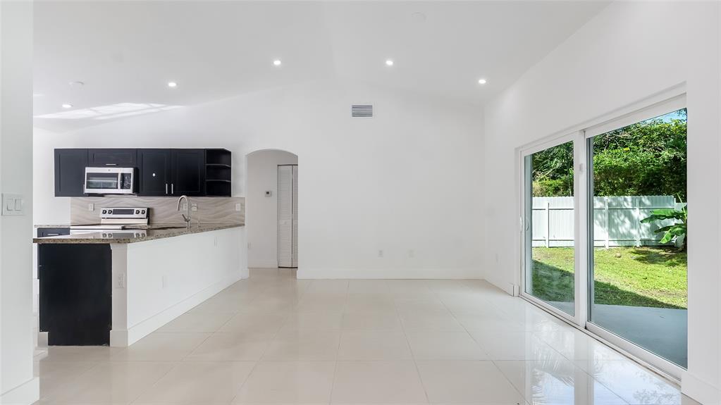 1811 Southwest 124th Way Miramar, FL 33027 - Photo 7 of 29 a view of kitchen with microwave and stove