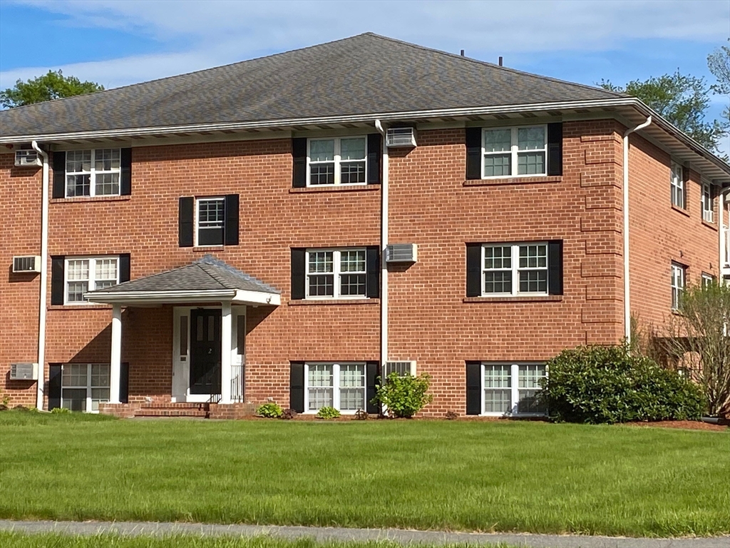 30 Leonard Road, Unit 30 Boxborough, MA 01719 - Photo 1 of 30 a front view of a house with a garden