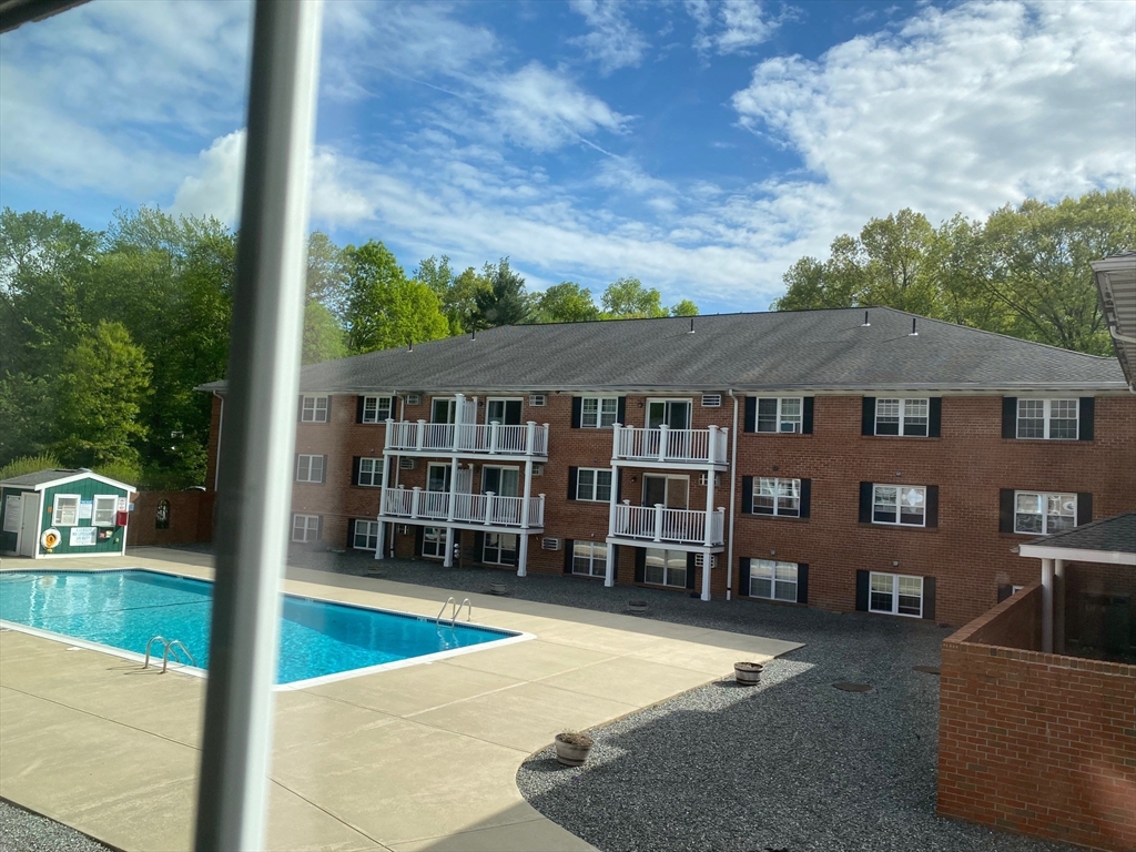 30 Leonard Road, Unit 30 Boxborough, MA 01719 - Photo 2 of 30 swimming pool with outdoor seating and yard