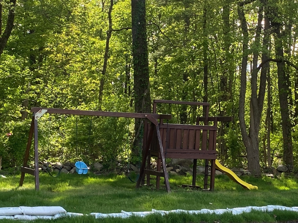 30 Leonard Road, Unit 30 Boxborough, MA 01719 - Photo 29 of 30 a view of backyard with trees and outdoor seating
