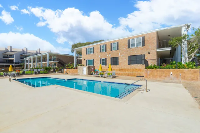 a view of swimming pool with outdoor seating