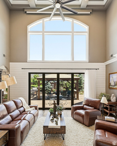 2204 Bridgewater Road Cedar City, UT 84721 - Photo 37 of 40 Indoor-Outdoor Living with a Skyhigh Coffer Ceiling, Two-Story Arched Transom Windows, Large Ceiling Fan, and Shiplap Paneling