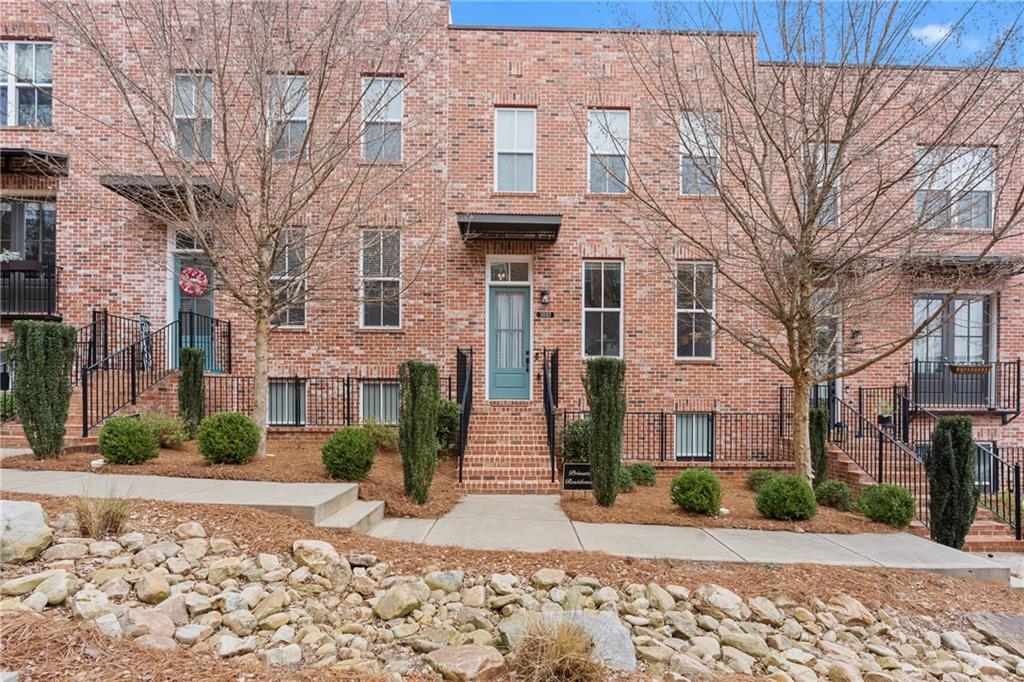 3880 Pr Fld Crossing Suwanee, GA 30024 - Photo 1 of 51 a view of a brick building next to a road