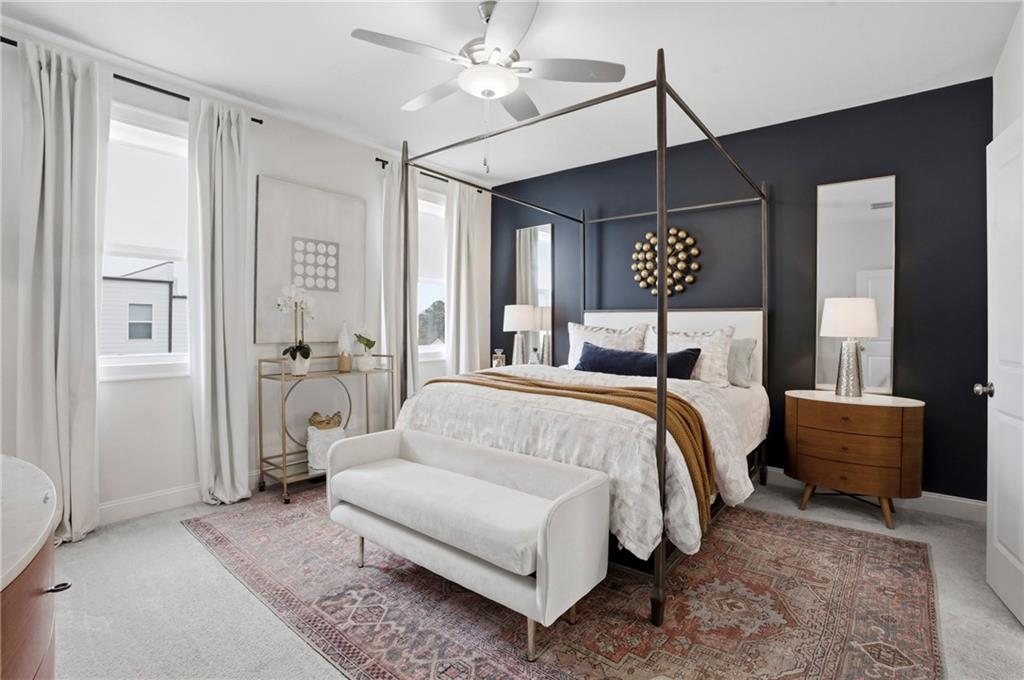 3880 Pr Fld Crossing Suwanee, GA 30024 - Photo 18 of 51 a bedroom with a large bed and a chandelier