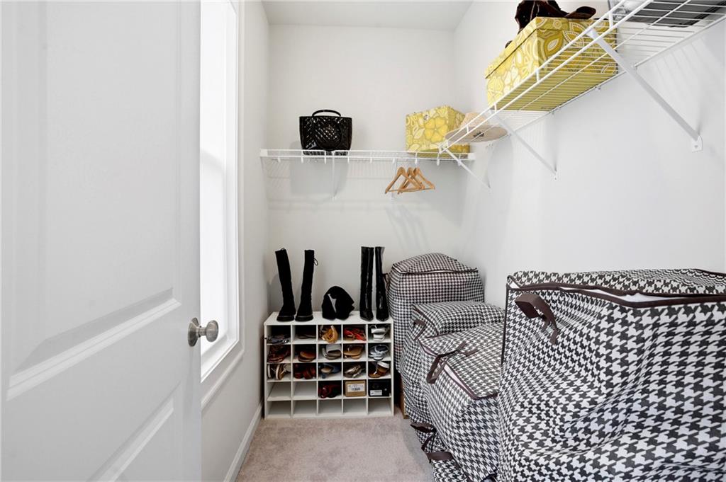3880 Pr Fld Crossing Suwanee, GA 30024 - Photo 29 of 51 a bedroom with a bed and a window