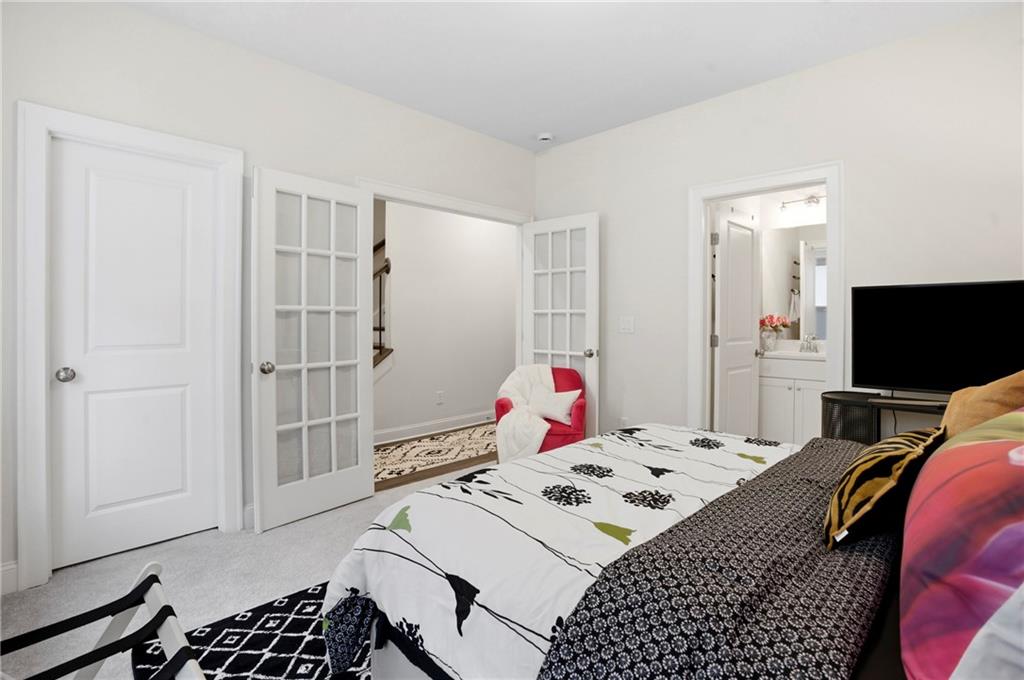 3880 Pr Fld Crossing Suwanee, GA 30024 - Photo 33 of 51 a bedroom with a bed and a flat screen tv