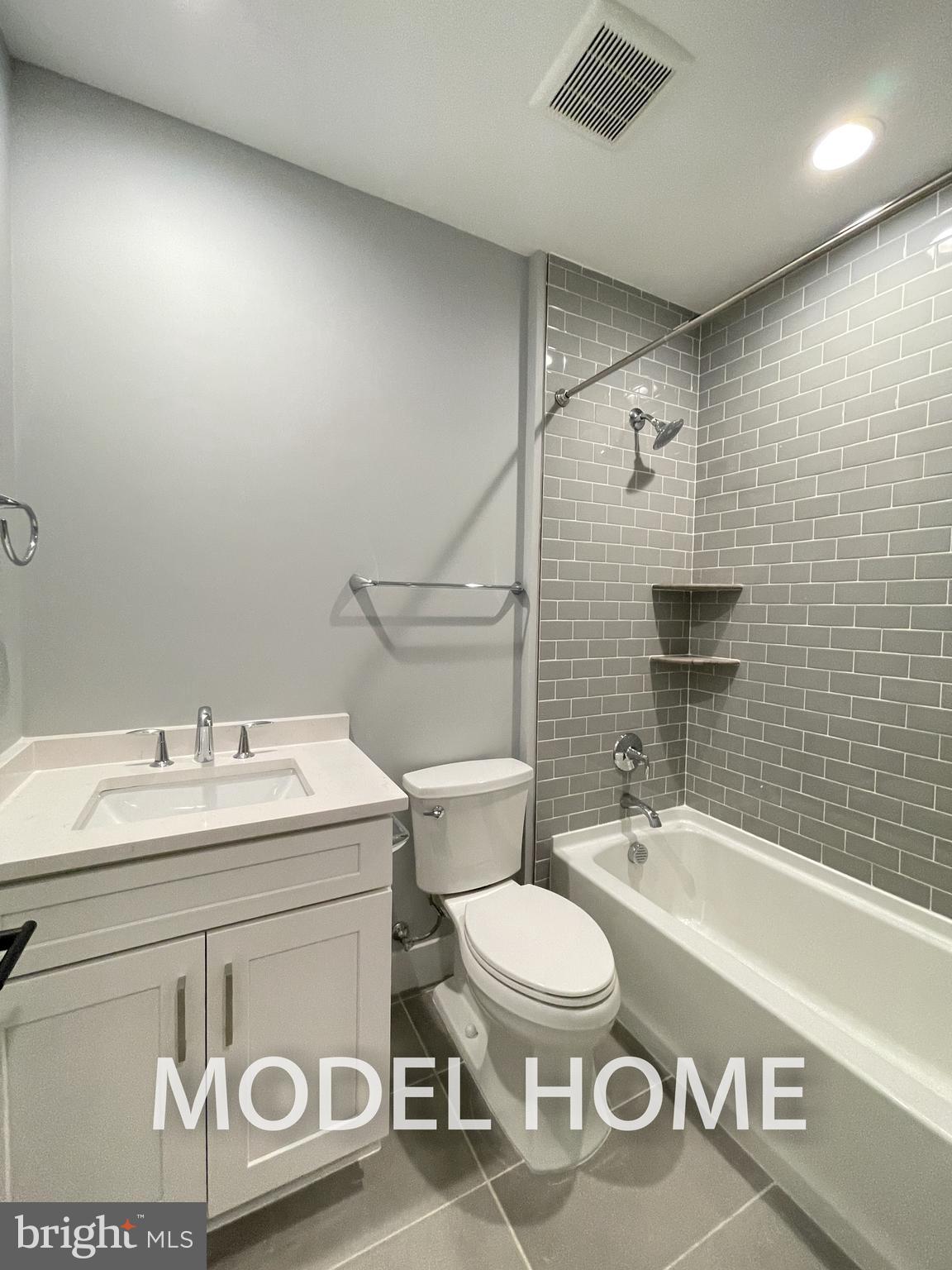 536 Walker Street Southwest Vienna, VA 22180 - Photo 50 of 57 a bathroom with a sink a toilet and a bathtub