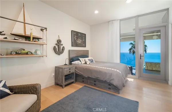 a bedroom with a bed and a couch