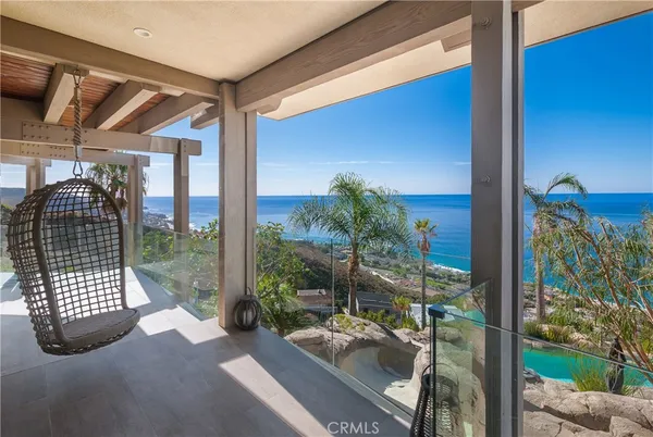 a view of a porch with a floor to ceiling window