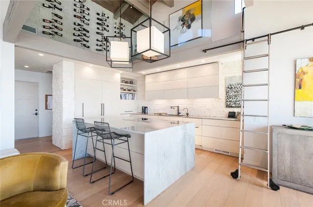 a kitchen with a sink a stove a refrigerator and cabinets