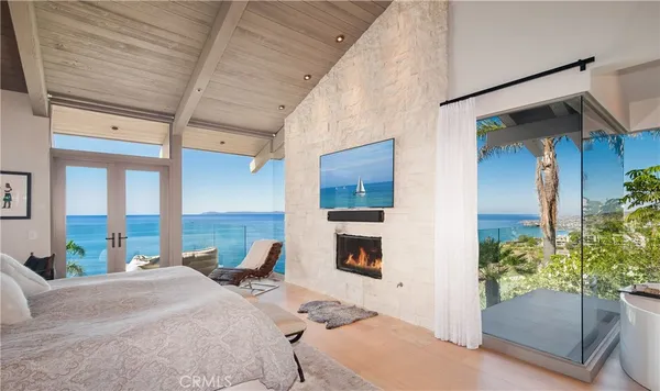 a bedroom with a bed and a potted plant