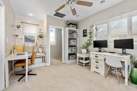 a view of a workspace with furniture