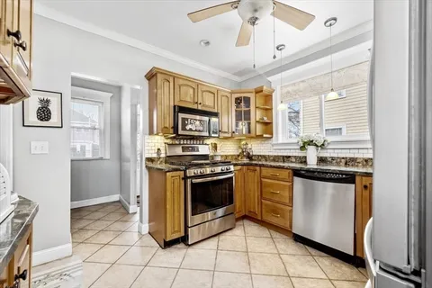 a kitchen with stainless steel appliances granite countertop a stove cabinets and a refrigerator