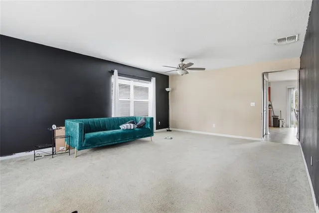 a living room with furniture and a window