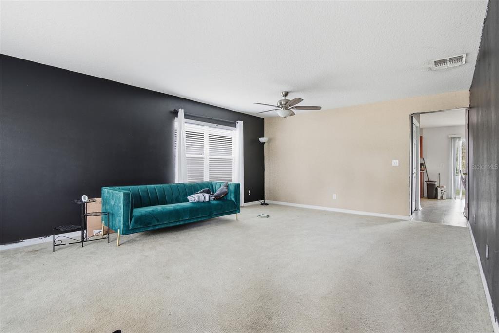 2463 Martins Run Tavares, FL 32778 - Photo 13 of 24 a living room with furniture and a window