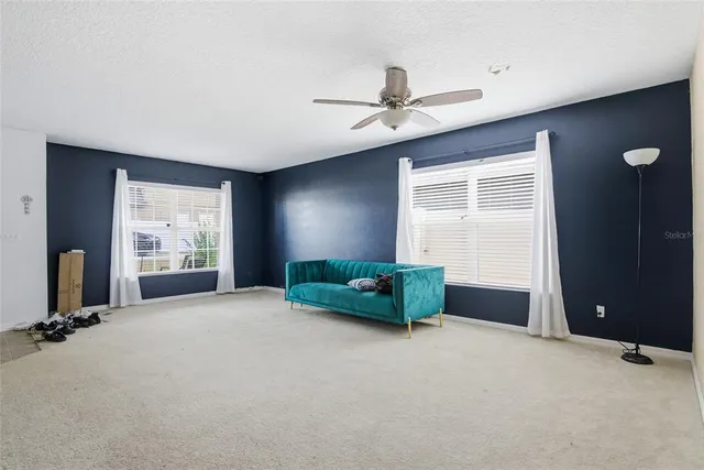 a kitchen with stainless steel appliances granite countertop a refrigerator stove microwave and sink