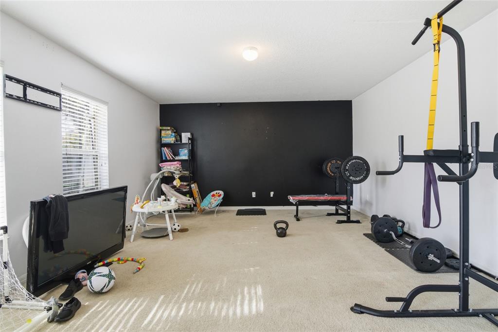 2463 Martins Run Tavares, FL 32778 - Photo 17 of 24 a view of a room with gym equipment