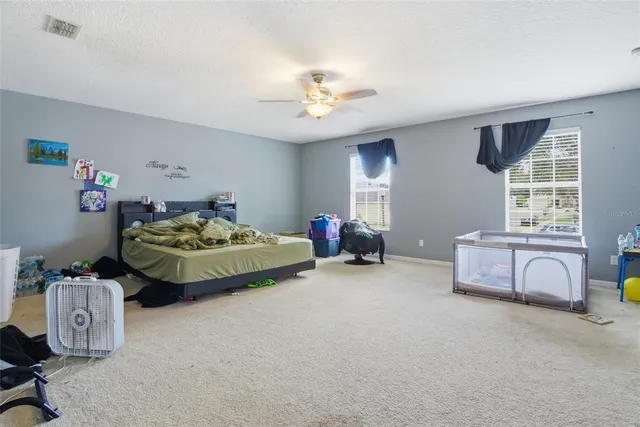 a view of a house with a yard and sitting area