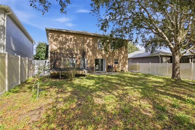 a backyard of a house with lots of green space