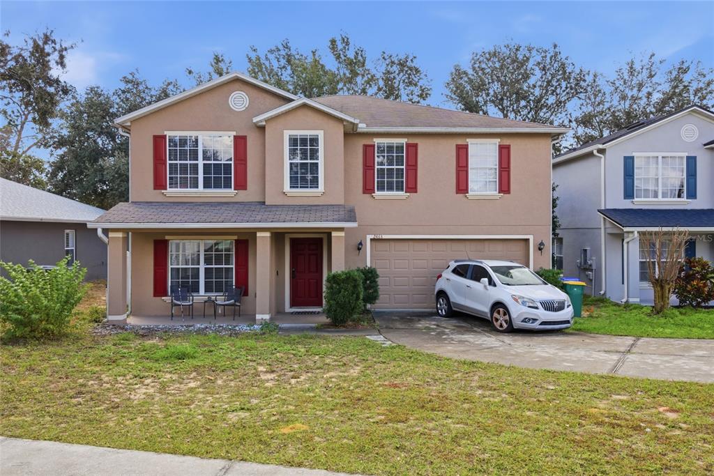 2463 Martins Run Tavares, FL 32778 - Photo 10 of 24 a front view of a house with garden