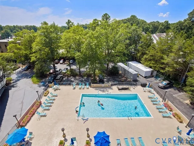 a view of a swimming pool and lounge chair