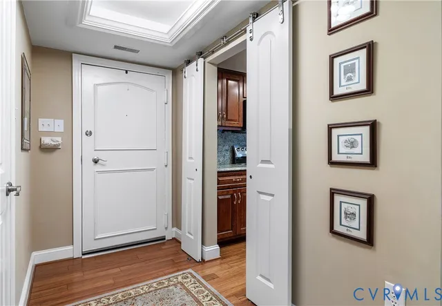 a kitchen with stainless steel appliances granite countertop a refrigerator and a stove